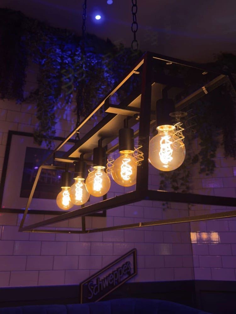 Filament lights hanging over the bar