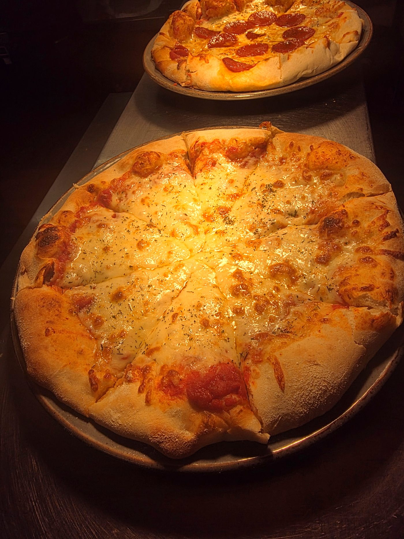 A homemade cheese pizza fresh from the oven