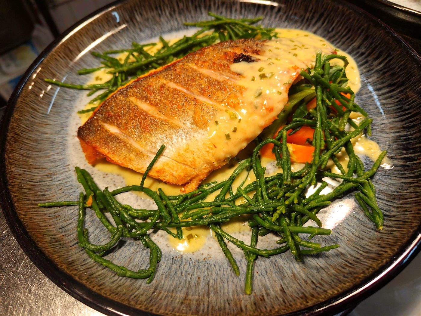 Pan-roasted sea bass with samphire and lemon butter sauce