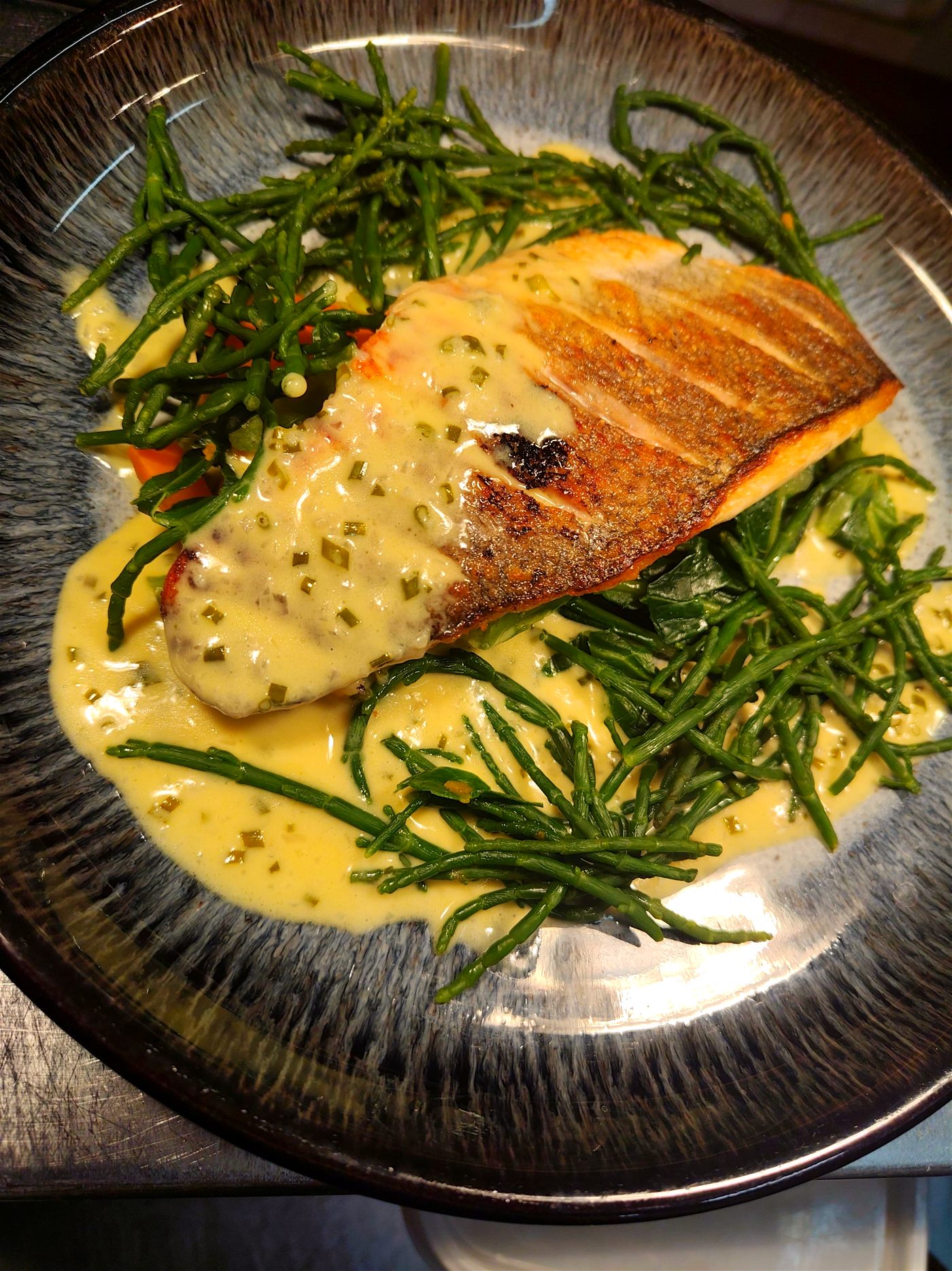 Pan-roasted sea bass with samphire and lemon butter sauce